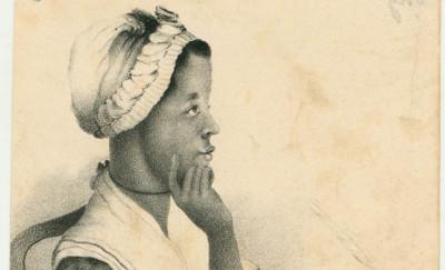 A lithograph of a Black woman seated at a table looking off to the left. She wears a white cap and shawl and a dark dress. Her right hand writes on a piece of paper with a quill pen, and she rests her left elbow on the table next to a small book, holding her chin thoughtfully in her hand. Below the portrait is the name "Phillis Wheatley."
